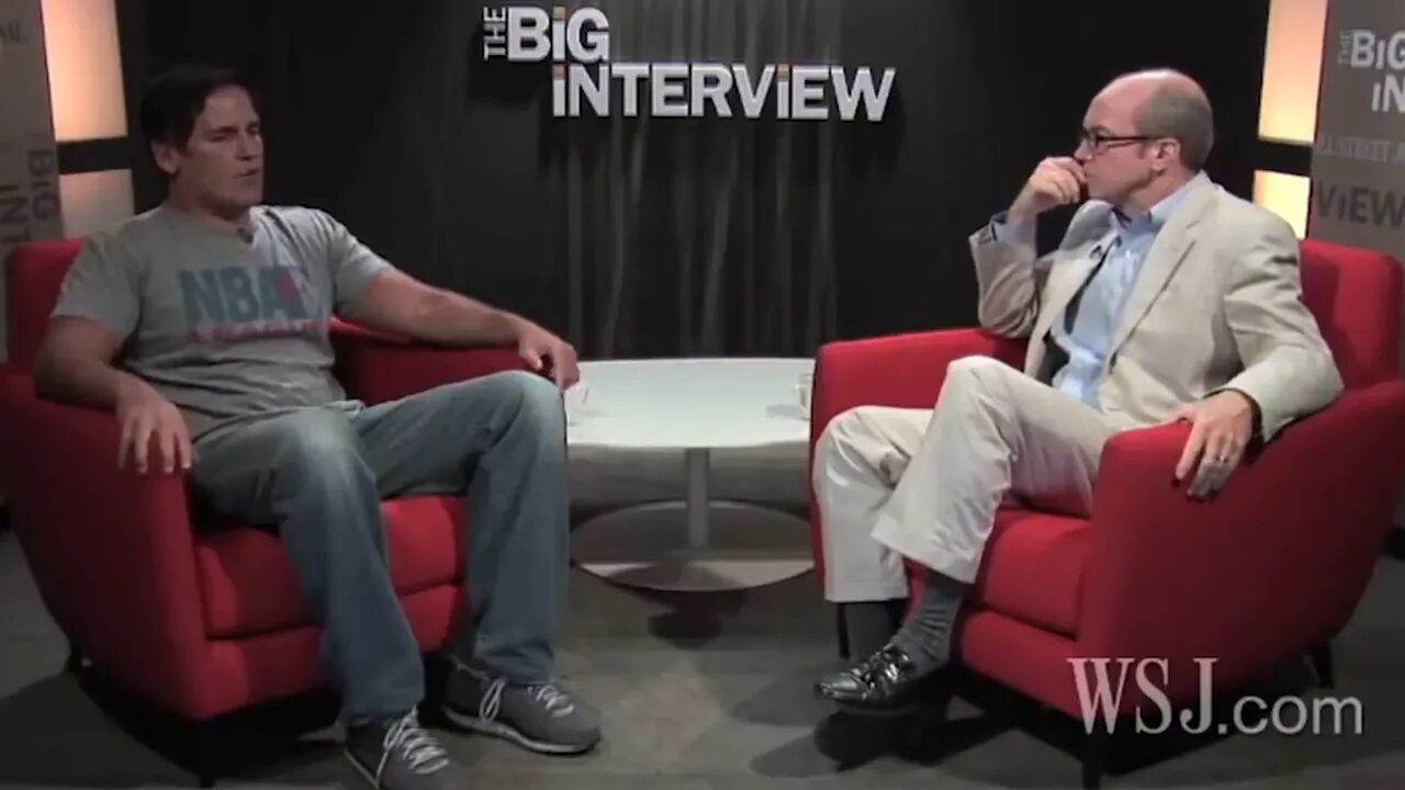 clear centered shot of two speakers on an interview set with 'The Big Interview' logo in the background