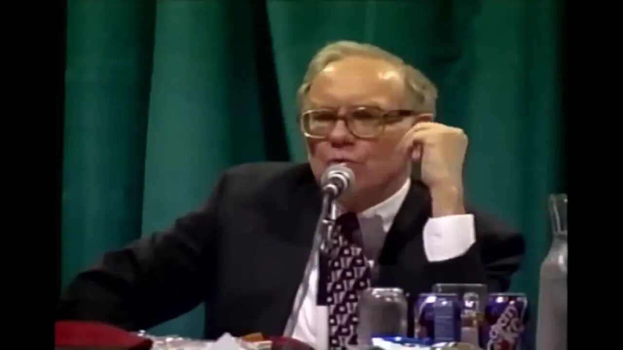 clear centered shot of speaker at microphone making a point in an investing talk