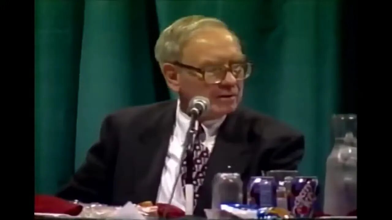 panel speaker looking to the side while speaking into a microphone at a conference