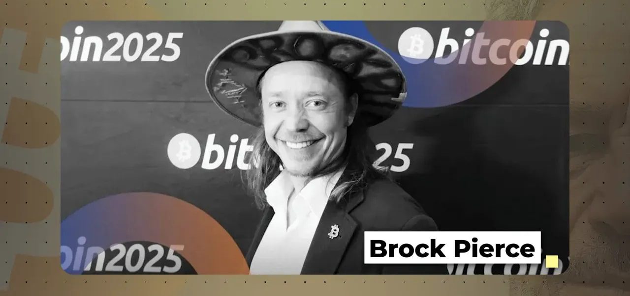 Black-and-white conference-style slide showing a smiling man in a hat with a conference backdrop bearing 'bitcoin' text and a lower-right name label.