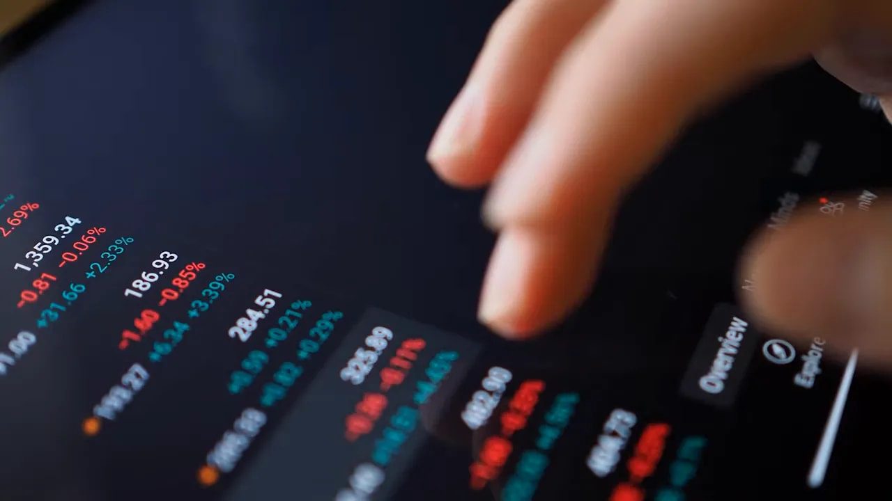 Close-up of crypto trading interface showing colored percentage changes and market/order values